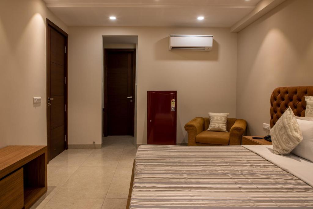 Postel nebo postele na pokoji v ubytování Perch Service Apartment-MG Road