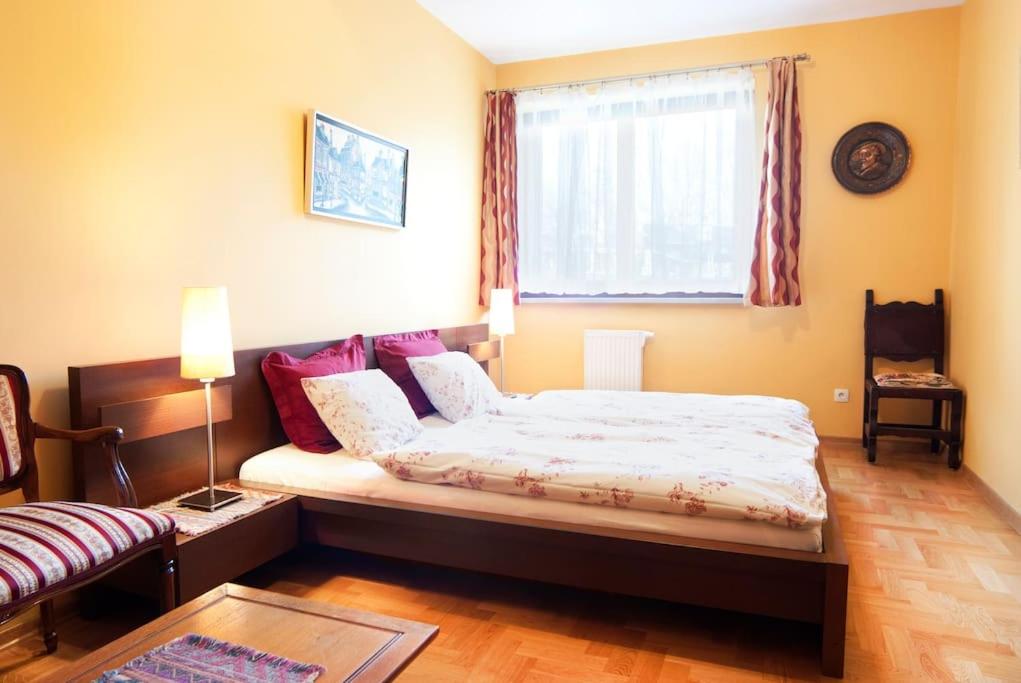 Posteľ alebo postele v izbe v ubytovaní Trinity Apartment
