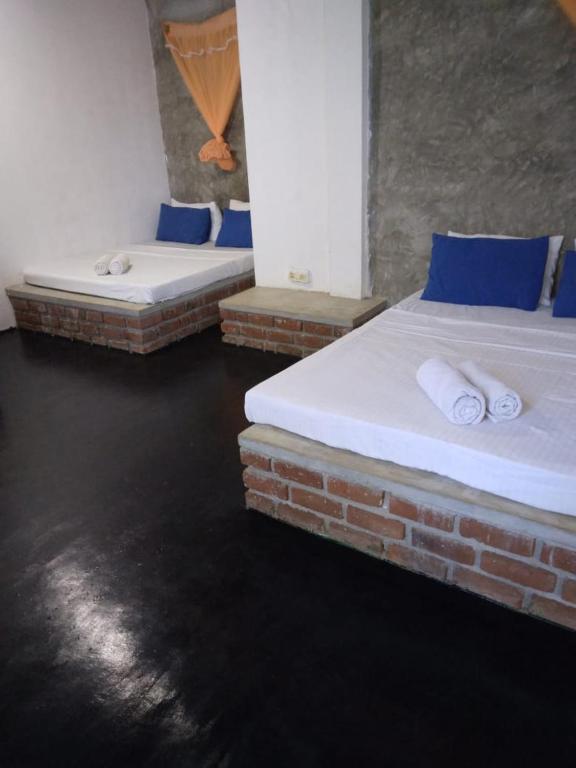 Postel nebo postele na pokoji v ubytování Rithu Homestay