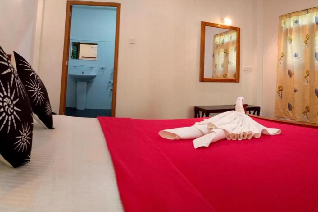 Postel nebo postele na pokoji v ubytování Suba Home Stay