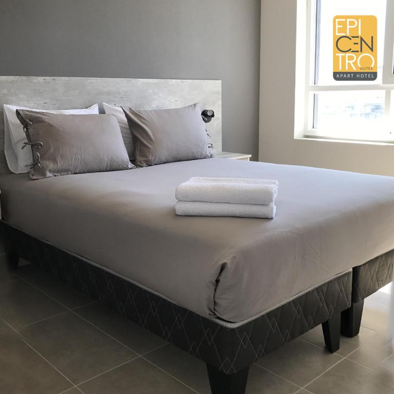 Voodi või voodid majutusasutuse Epicentro Suites Apart Hotel - Temuco toas