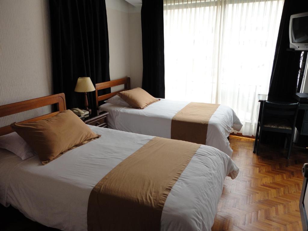 Postel nebo postele na pokoji v ubytování Hotel Rincón Escandinavo