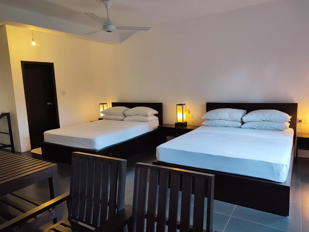 Postel nebo postele na pokoji v ubytování Lakmini Lodge Sigiriya