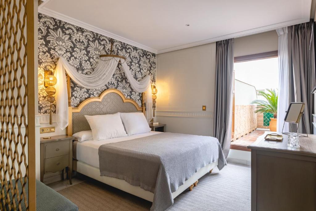 Postel nebo postele na pokoji v ubytování Hotel Gravina 51