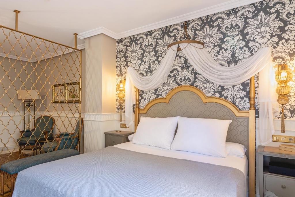Postel nebo postele na pokoji v ubytování Hotel Gravina 51