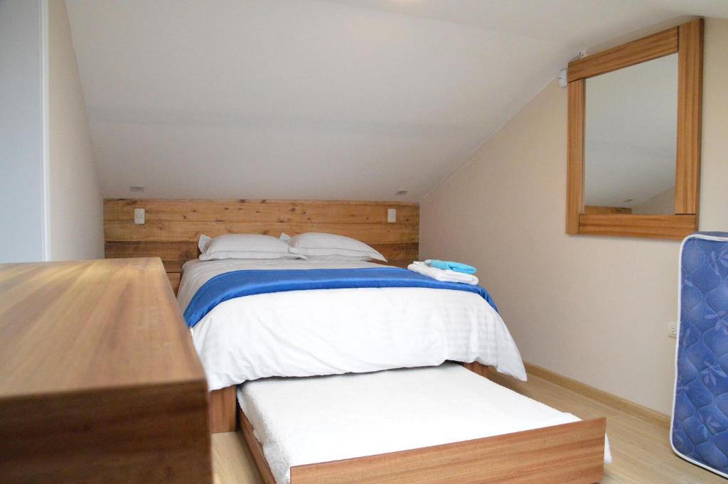 Een bed of bedden in een kamer bij VFC Suites Cuenca - Ecuador