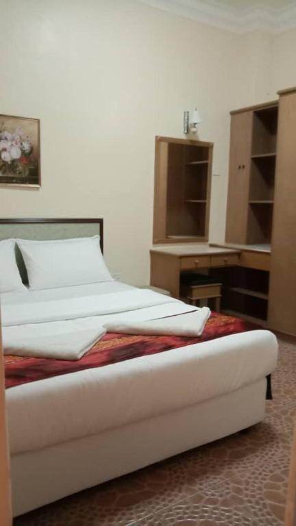 Postel nebo postele na pokoji v ubytování Apartment Teluk Batik