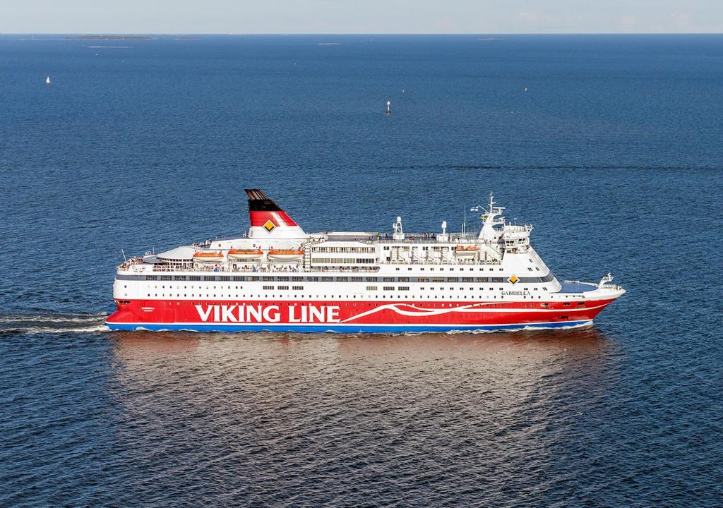 a large red and white cruise ship in the ocean at Viking Line ferry Gabriella - One-way journey from Helsinki to Stockholm in Helsinki