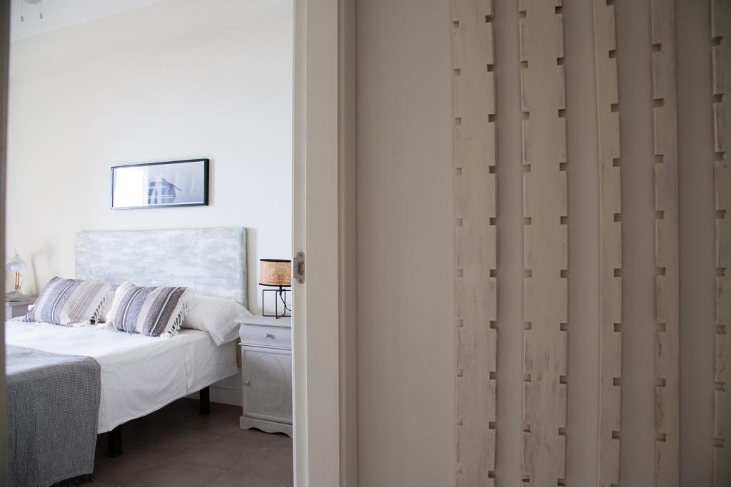 A bed or beds in a room at Vistas al Mar junto a la Playa 3D