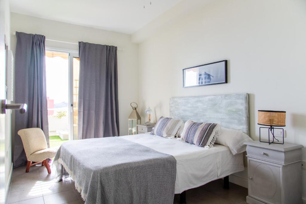 A bed or beds in a room at Vistas al Mar junto a la Playa 3D