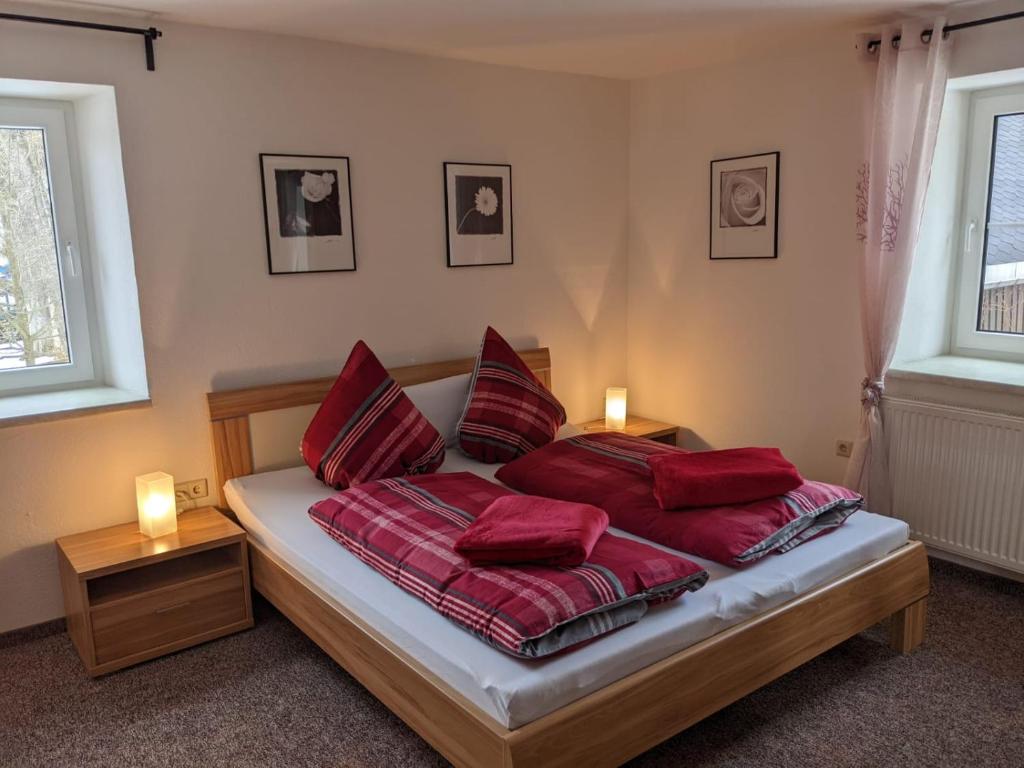Кровать или кровати в номере Ferienwohnungen Schönherr