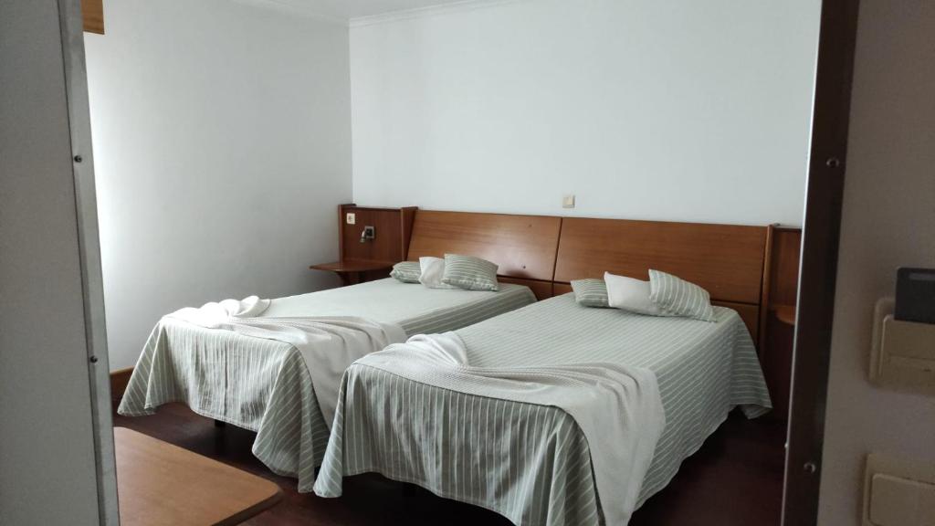 Postel nebo postele na pokoji v ubytování Hotel Comodoro