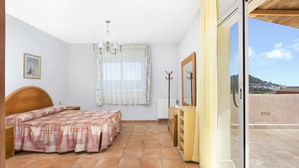Postel nebo postele na pokoji v ubytování 2Delpi - Blanes