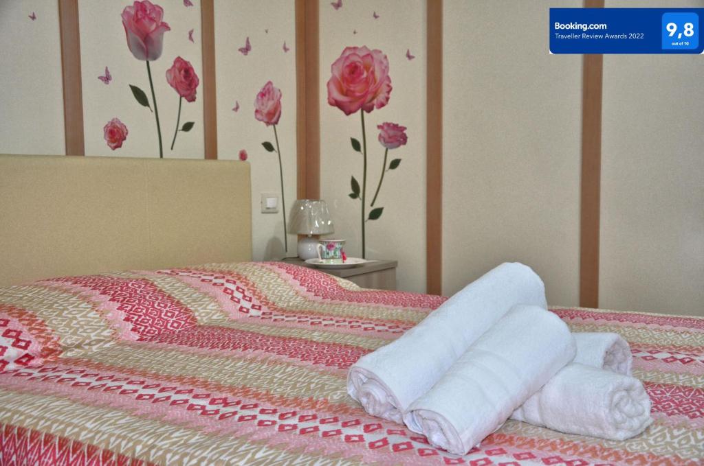 Postel nebo postele na pokoji v ubytování Rosa Vesuviana