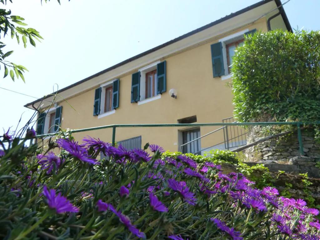 a building with purple flowers in front of it at Casa dei Fiori in Casanova Lerrore