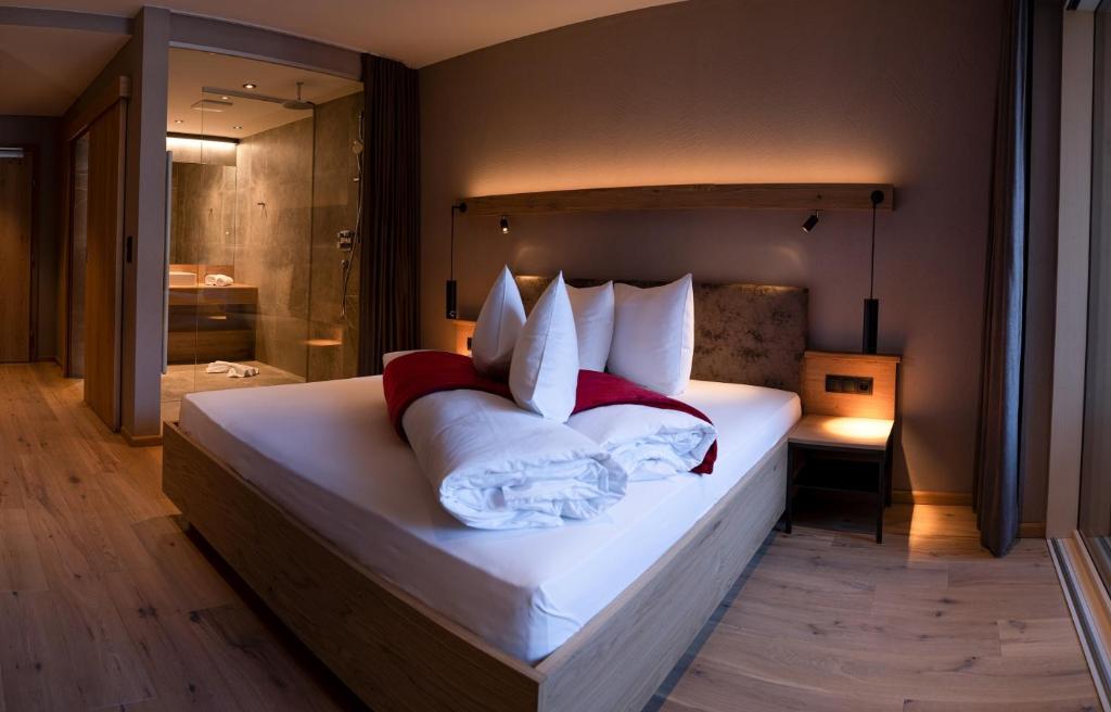 Postel nebo postele na pokoji v ubytování Hotel Post