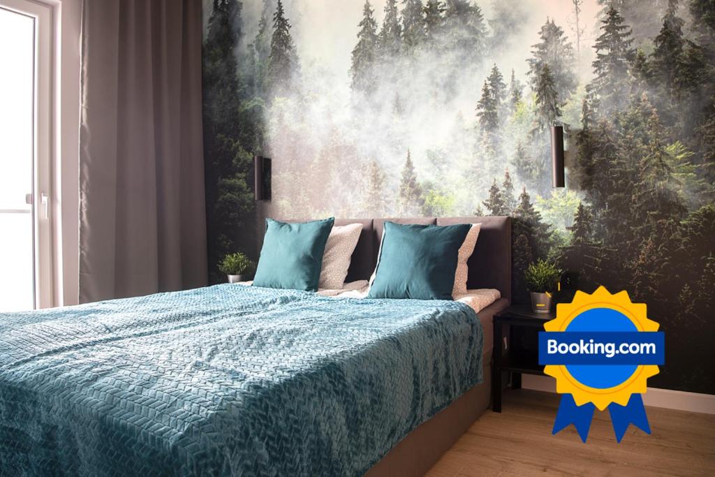 Posteľ alebo postele v izbe v ubytovaní Wola Loft Apartment