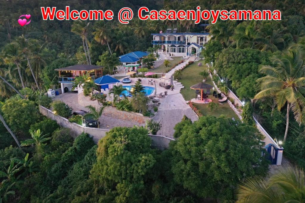 an aerial view of a mansion in the woods at casaenjoysamana in Los Naranjos