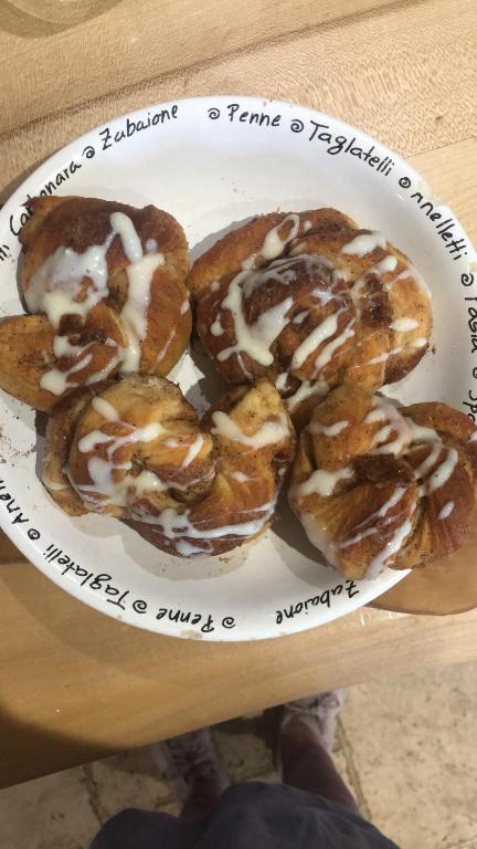 a plate with four donuts on a table at Stone Lodge B&B in Balrath