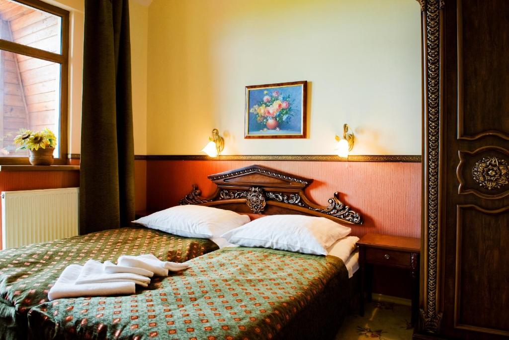 Postel nebo postele na pokoji v ubytování Perła Karkonoszy SPA - W samym centrum Karpacza