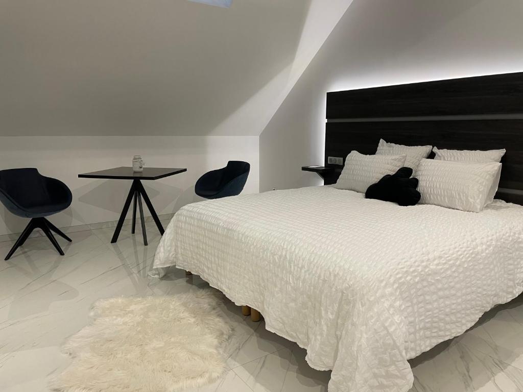 Postel nebo postele na pokoji v ubytování Les chambres d'à côté