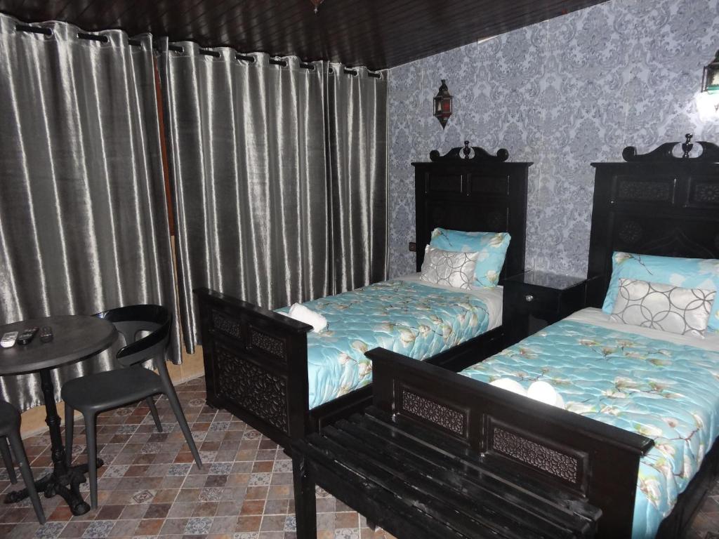 Katil atau katil-katil dalam bilik di HOTEL PEDRO