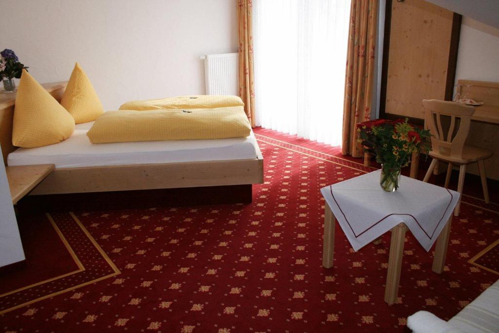 Postel nebo postele na pokoji v ubytování Alpenhof Reuterwanne