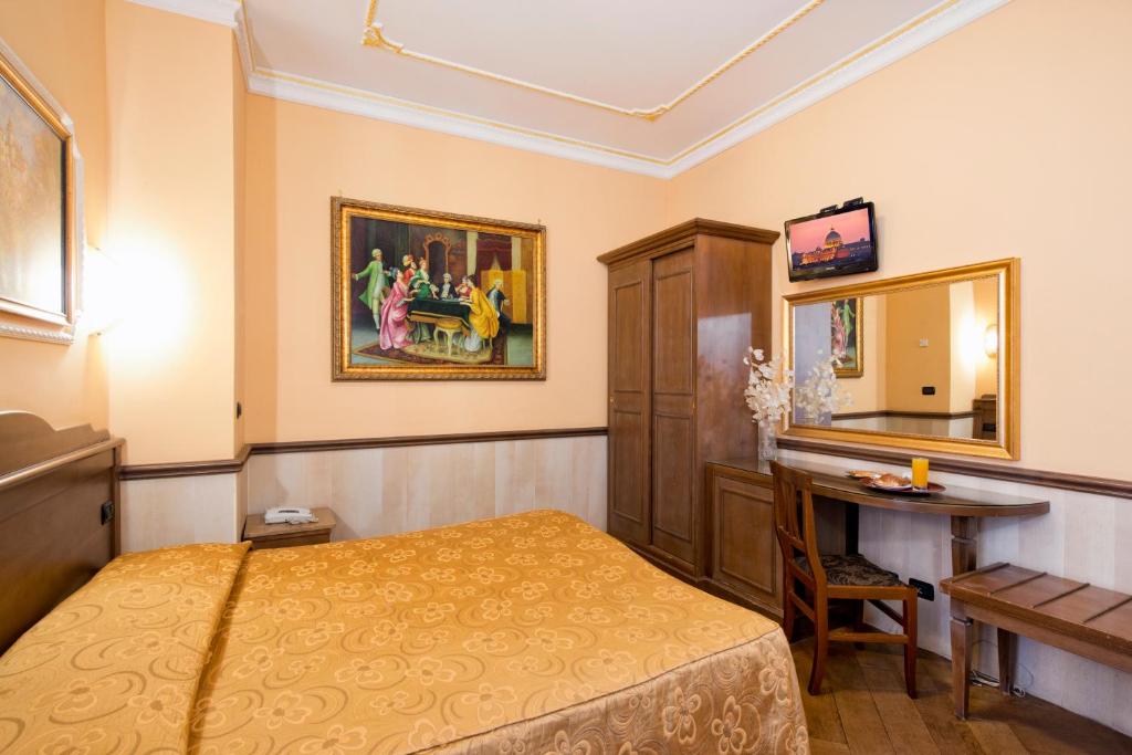 Postel nebo postele na pokoji v ubytování Hotel Marco Polo Rome