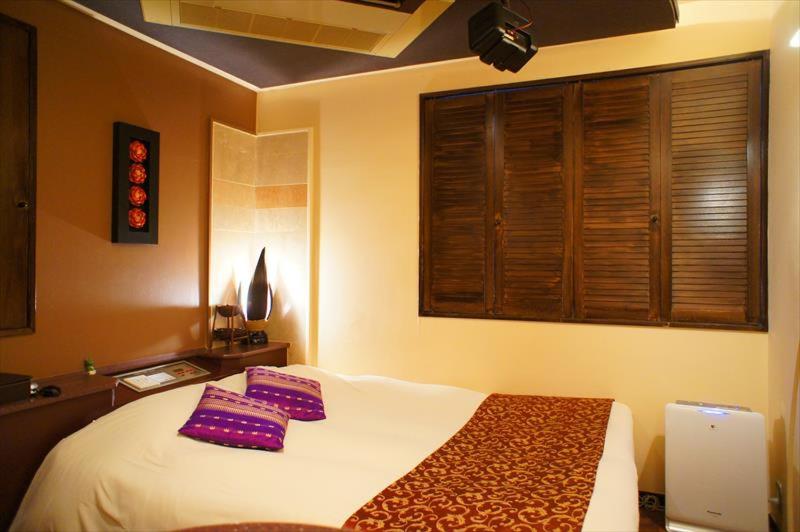 Postel nebo postele na pokoji v ubytování HOTEL CHECK INN BALI adult only