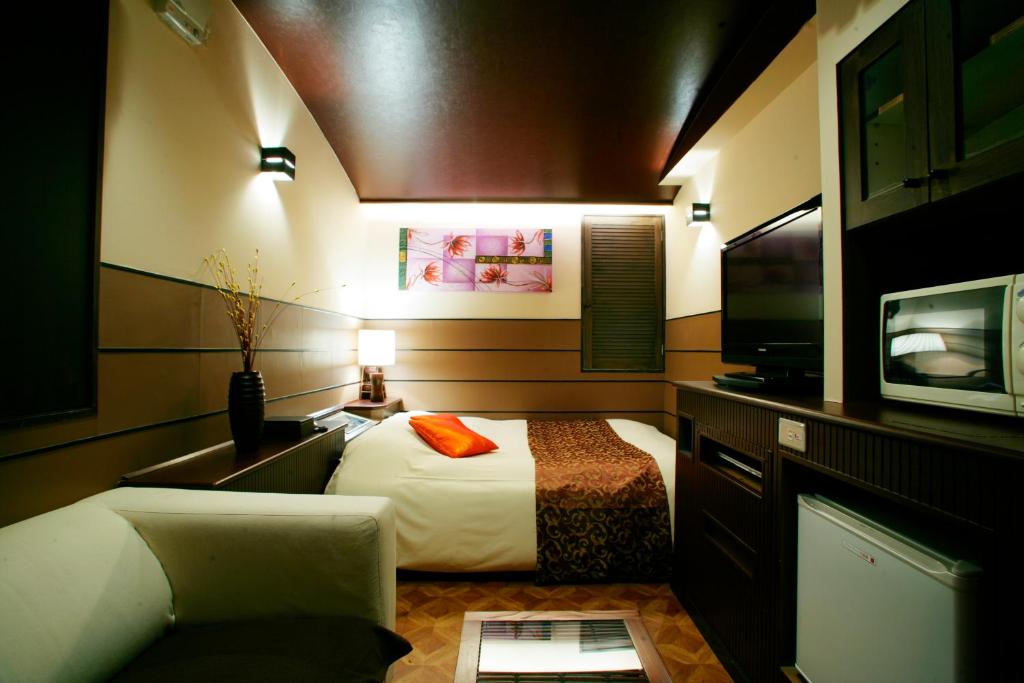 Kuchyň nebo kuchyňský kout v ubytování HOTEL CHECK INN BALI adult only
