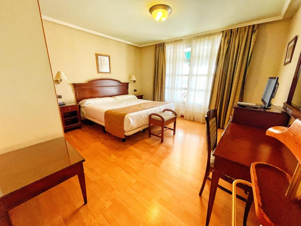 Cama o camas de una habitación en Hotel Lasa Sport