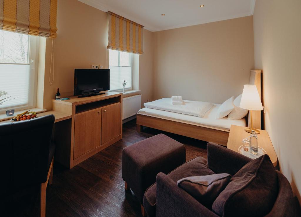 Postel nebo postele na pokoji v ubytování Hotel Jungclaus