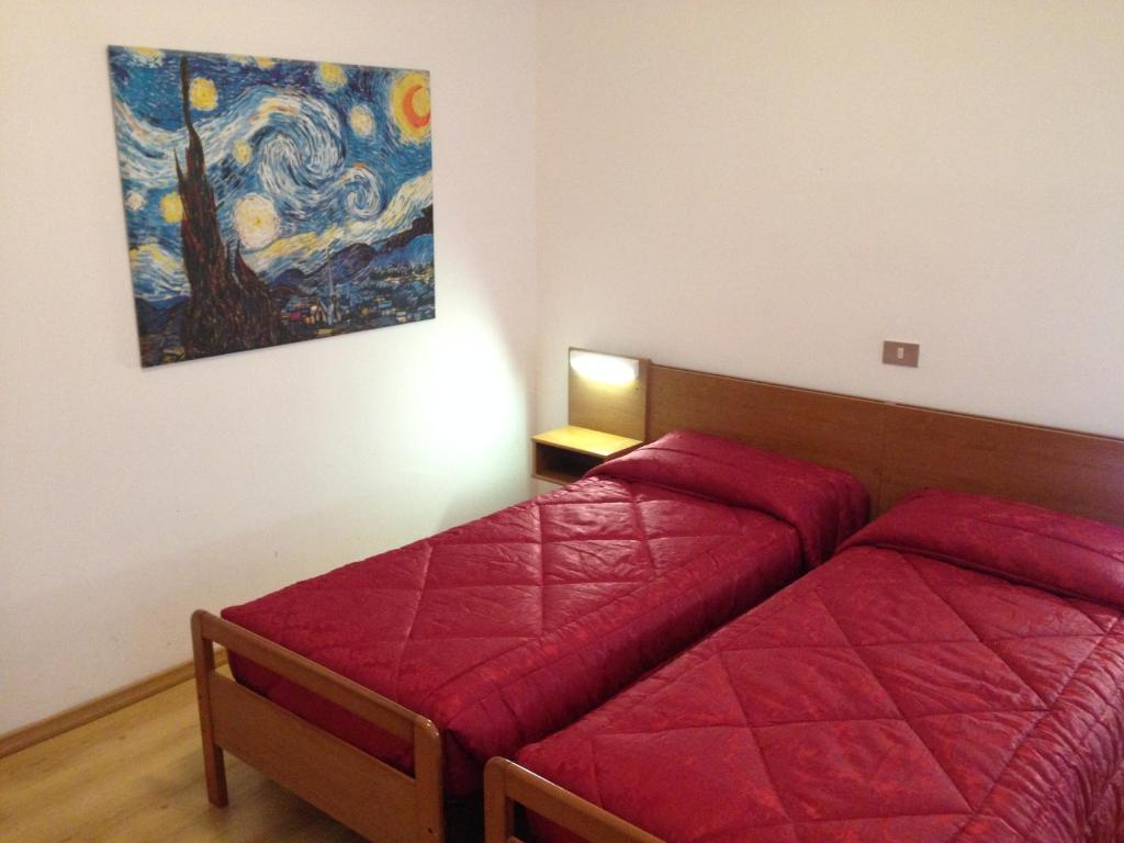 Postel nebo postele na pokoji v ubytování Hotel Caprera