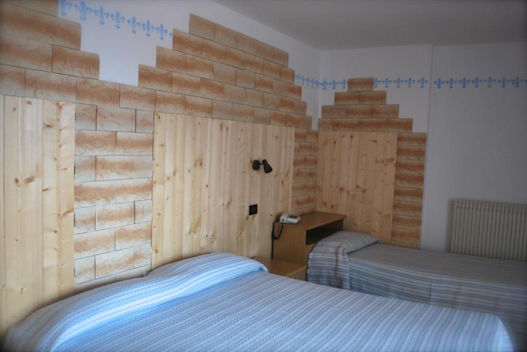 Letto o letti in una camera di Maso La Vecchia Quercia