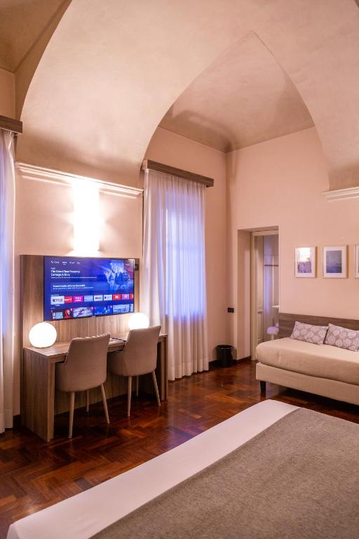 Postel nebo postele na pokoji v ubytování Hotel Boutique Antiche Mura