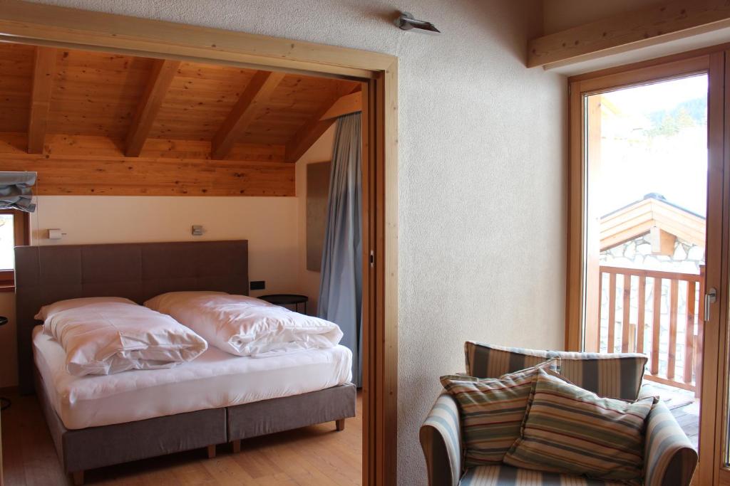Postel nebo postele na pokoji v ubytování ClubHotel Hinterthal Am FlorySee 12