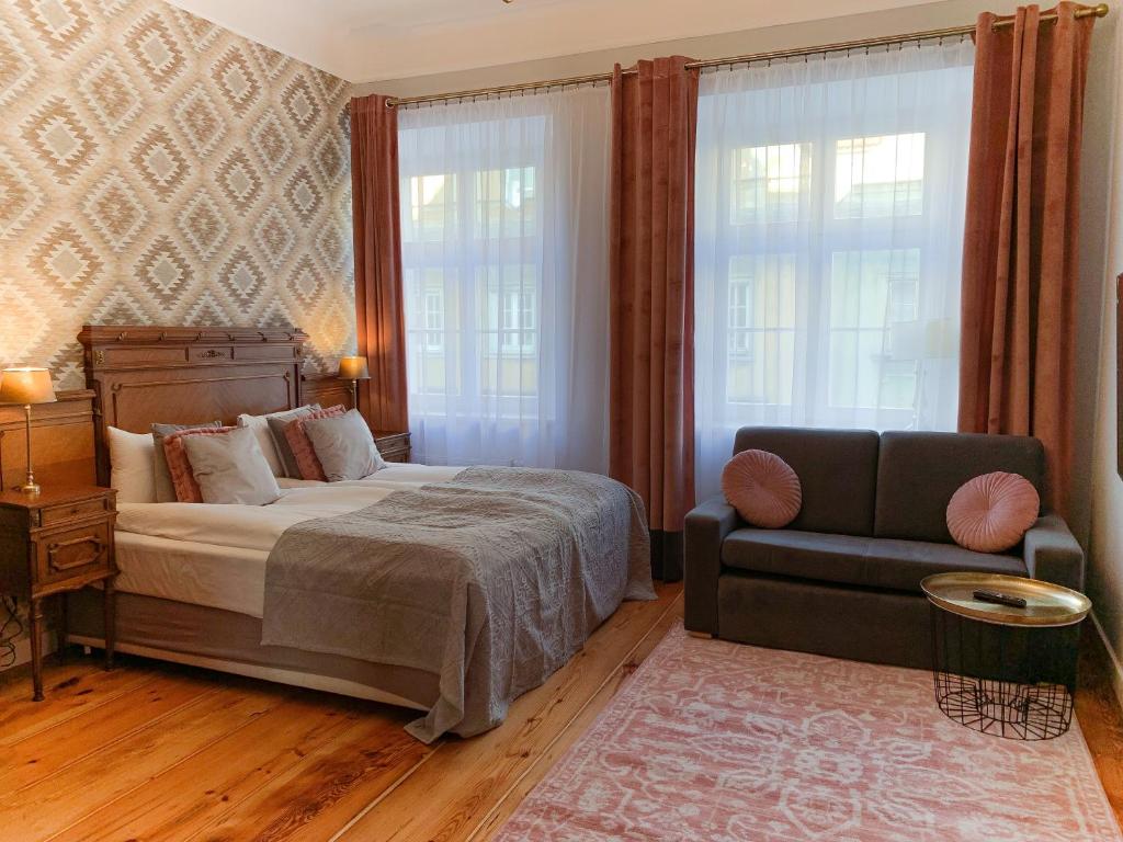 Postel nebo postele na pokoji v ubytování Apartamenty Plac Kolegiacki