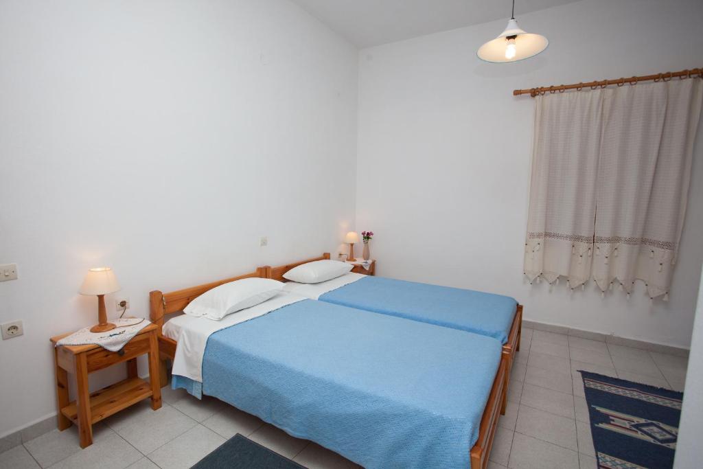 Postel nebo postele na pokoji v ubytování Anestoula Rooms