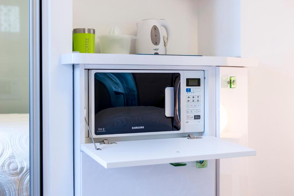 Televízia a/alebo spoločenská miestnosť v ubytovaní ToMaDi Residence