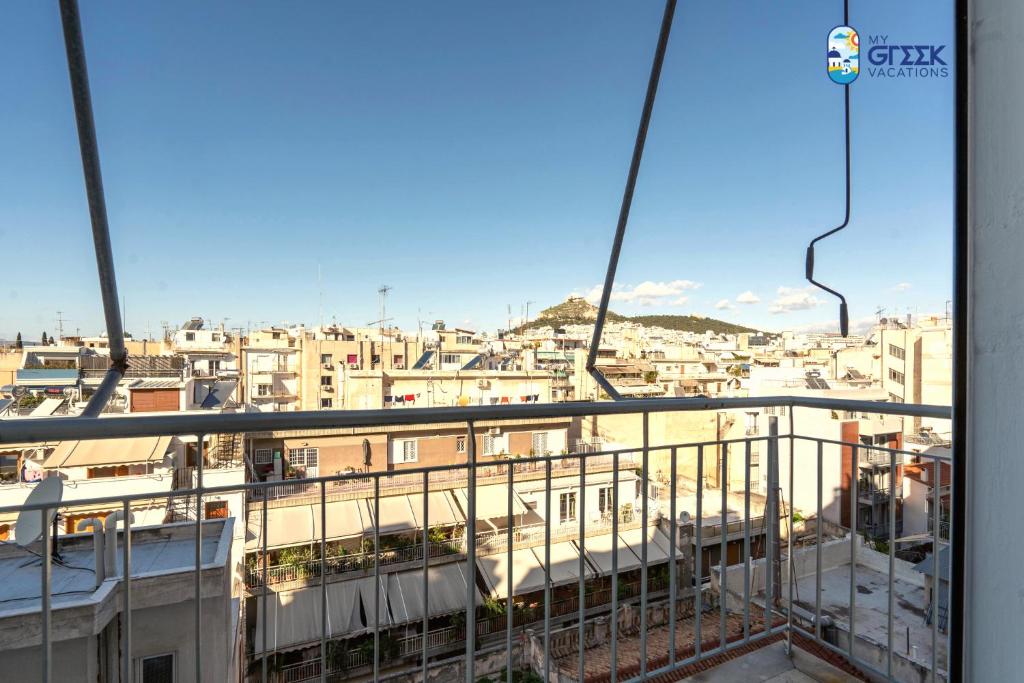 a view of a city from a balcony at The Spiritual Athens Apartment in Athens