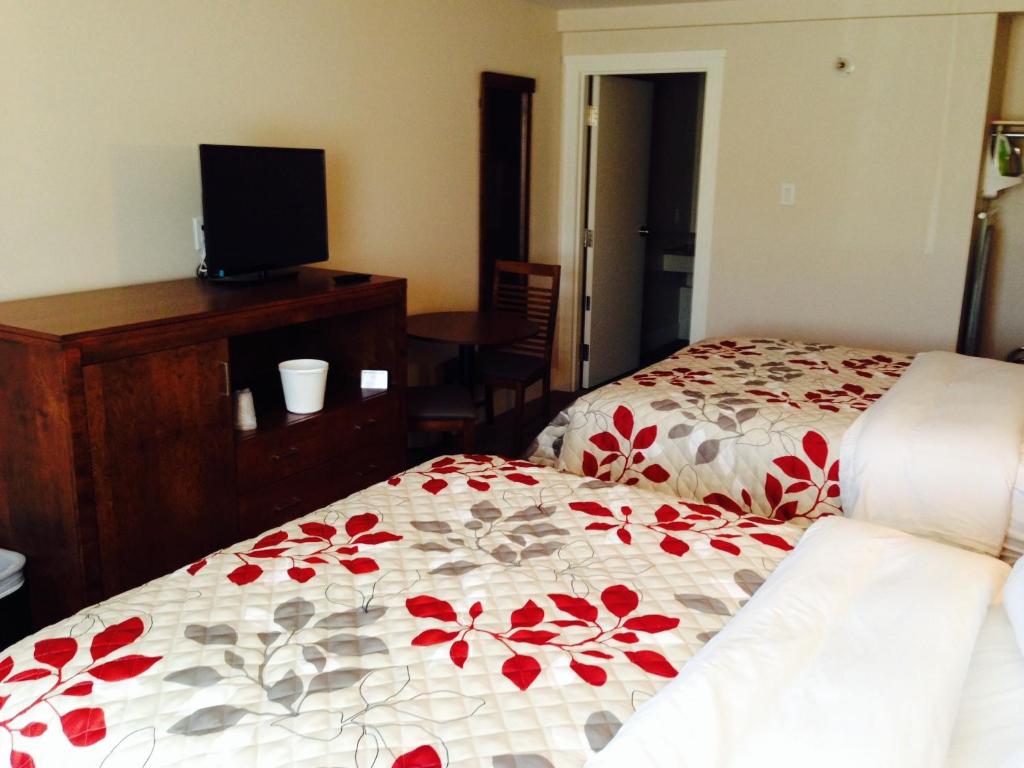 Postel nebo postele na pokoji v ubytování Motel Beausejour