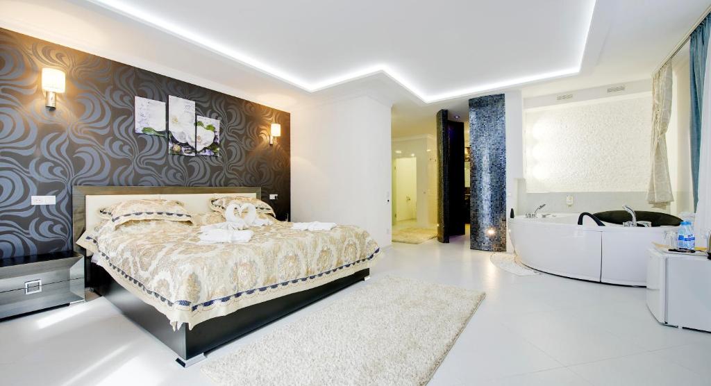 Postel nebo postele na pokoji v ubytování Pearl Mini-Hotel
