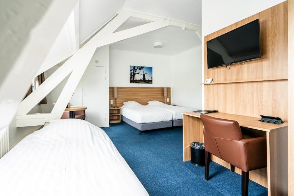 Postel nebo postele na pokoji v ubytování Hotel Hulst