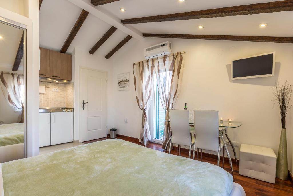 Televízia a/alebo spoločenská miestnosť v ubytovaní ToMaDi Residence