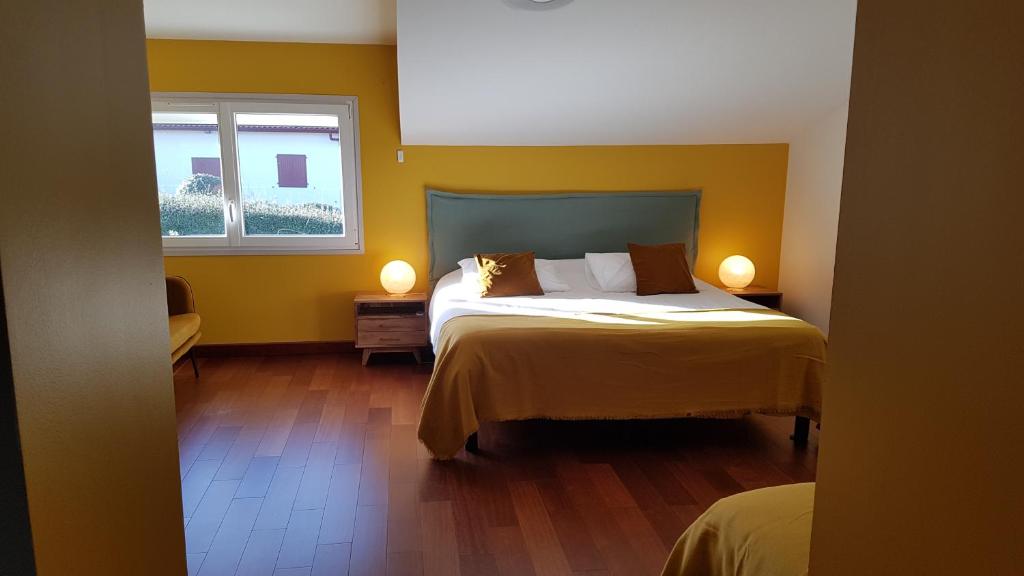 Postel nebo postele na pokoji v ubytování Aux Sources d'Hossegor