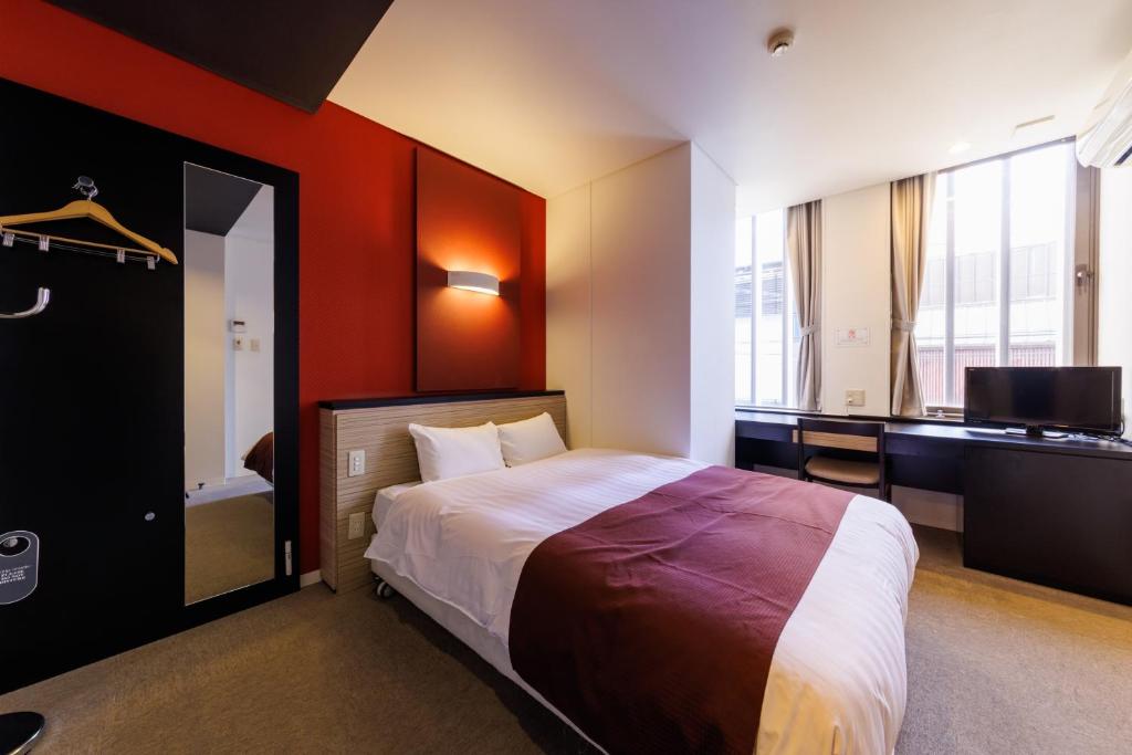 Postel nebo postele na pokoji v ubytování Hotel Fosse Himeji