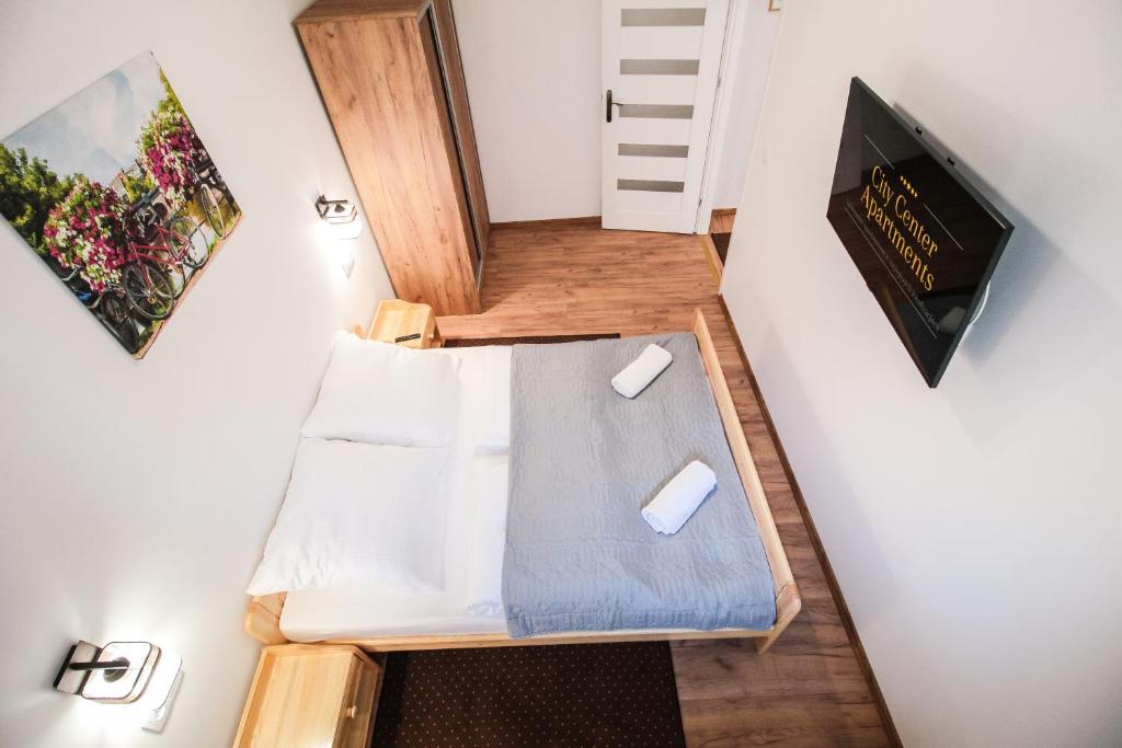 Televízia a/alebo spoločenská miestnosť v ubytovaní Apartament City Center Standard 6