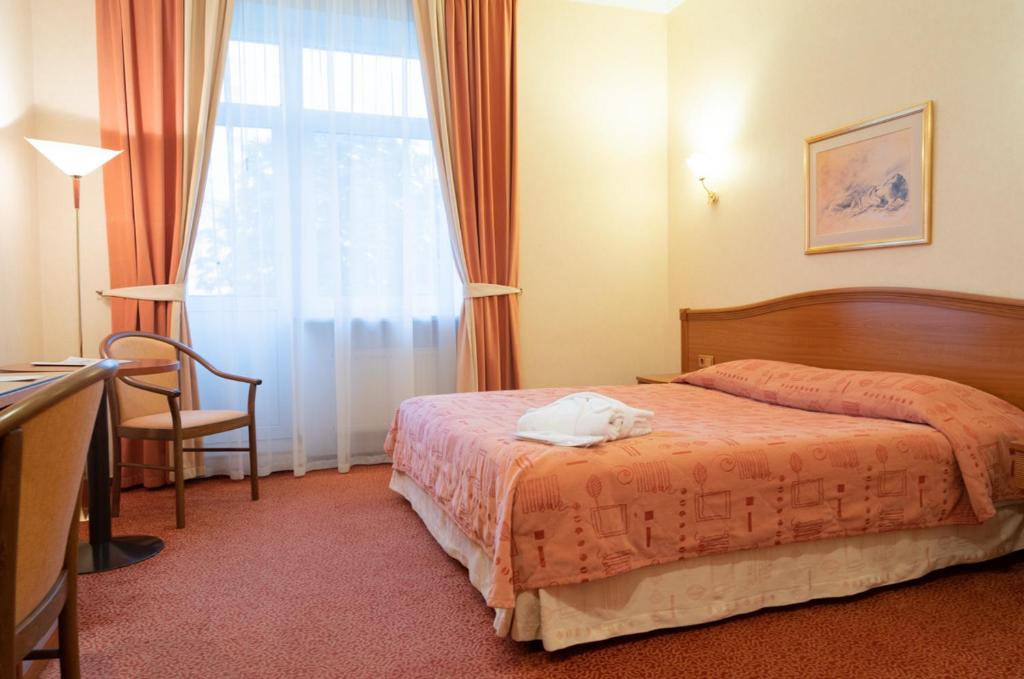 Кровать или кровати в номере Селект Отель Павелецкая