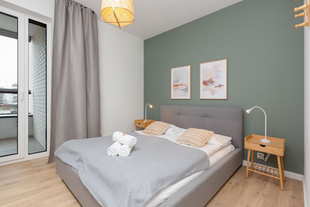 Posteľ alebo postele v izbe v ubytovaní Artistic Żoliborz Apartments by Noclegi Renters