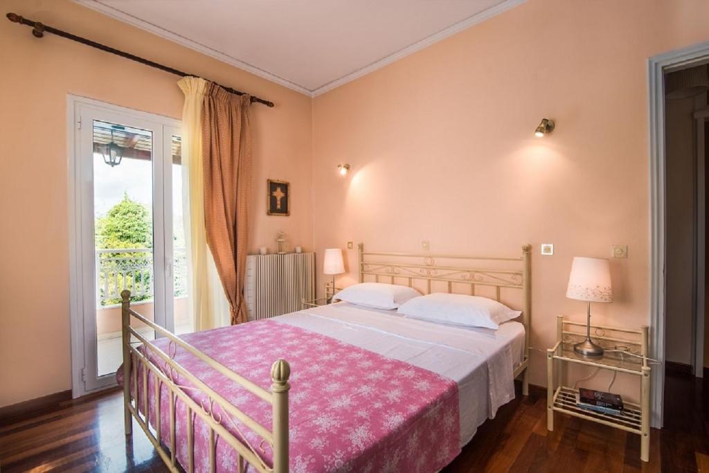 Posteľ alebo postele v izbe v ubytovaní Chara's House